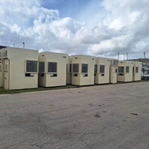 Bullet-resistant guard booths aligned in a straight row