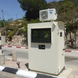 bulletproof gurad shack with an air conditioner on the roof